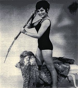 Laura Bergt with harpoon and bathing suit