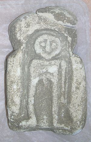 Limestone figurative carving, probably an altar piece depicting a naked man (FindID 52144-8647)