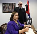 Mary Lou McDonald with Dr Hermes Herrera Hernández signing the book of condolence to Fidel Castro at the Cuban Embassy in Dublin (30489680553)