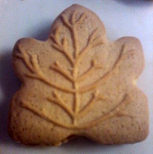 One maple leaf cookie on a plate.jpg