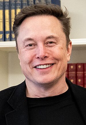 Portrait of Elon Musk, a white, middle-age man with short, dark hair, wearing a black shirt
