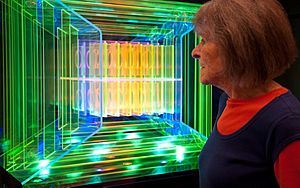 Dorothy Tanner looking at the light sculpture, Logo, by Dorothy and Mel Tanner.jpg