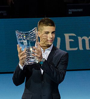2014-11-12 2014 ATP World Tour Finals Borna Coric receiving trophy for ATP Star of tomorrow 2014 2 by Michael Frey