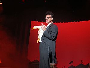 Ed Alonzo holding Bob the Duck while performing at Kings Island