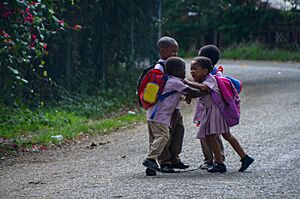 Fighting after school in central Jamaica - all shoelaces are open (32361821164)