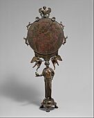 Bronze mirror with a support in the form of a draped woman MET DT276