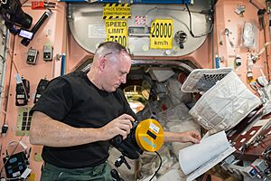 Expedition 41 Wilmore reads about IMAX camera