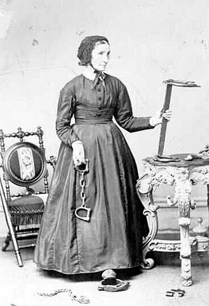 Laura Haviland holding slave irons ca. 1864