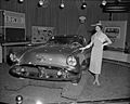 Model posing with the 1954 Oldsmobile Cutlass show car on display at the General Motors Motrorama 1955