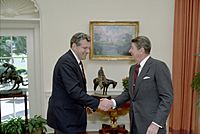 President Ronald Reagan meeting with William Bennett in the Oval Office
