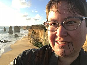 Thirza Cuthand the Filmmaker, standing at 12 Apostles in Australia.jpg