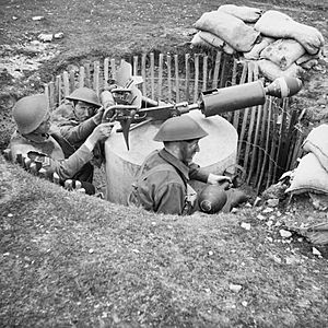 Home Guard soldiers operate a 'Blacker Bombard' spigot mortar during training at No. 3 GHQ Home Guard School at Onibury near Craven Arms in Shropshire, 20 May 1943. H30181