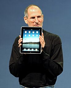 Steve Jobs with the Apple iPad no logo (cropped)