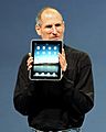 Steve Jobs with the Apple iPad no logo (cropped)