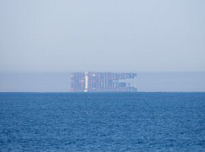 A Fata Morgana of a cargo ship seen off the coast of Oceanside, California