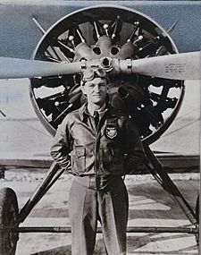 Capt. C.L Chennault, leader of The Flying Trapeze poses in front of a Boeing P-12E