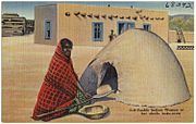 G-50 Pueblo Indian woman at her adobe bake-oven