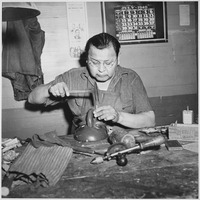 Jesse Cornplanter making a ceremonial mask, Tonawanda Community House, Tonawanda, New York. Photographed in 1940.