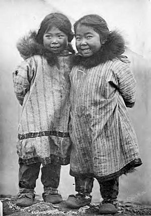 Two smiling Kauwerak Eskimo girls wearing print cotton parkas, Nome, Alaska, between 1903 and 1910 (AL+CA 6372)
