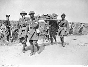 Indian Army soldiers carry a wounded officer on a stretcher in France