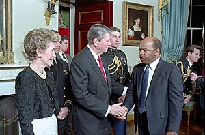 President Ronald Reagan and Nancy Reagan greet John Lewis
