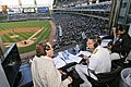 The commander of Naval Service Training Command speaks to Ed Farmer, Major League Baseball’s Chicago White Sox radio play-by-play broadcaster during a White Sox game against the Toronto Blue Jays at U. S. Cellular Field.