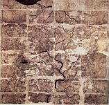 A slightly tattered silk map with geographical features and outlines of rivers