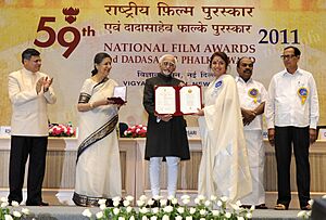 Mohd. Hamid Ansari presenting the Rajat Kamal Award to Ms Revathy for BEST FILM ON FAMILY VALUES Red Building where the Sun Sets (English), at the 59th National Film Awards function