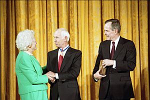 President George H. W. Bush and Mrs. Barbara Bush award the Presidential Medal of Freedom to comedian Johnny Carson