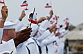 US Navy 040723-N-8213G-176 USS Ronald Reagan (CVN 76) Sailors waive the California state flag symbolic of their new homeport at Naval Air Station North Island, San Diego, Calif