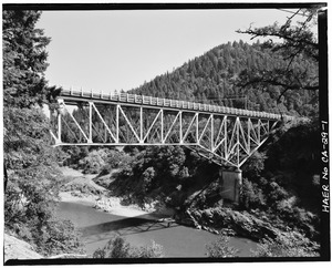 View to northeast. Oblique view of upstream side of bridge. (90mm lens) - South Fork Trinity River Bridge, State Highway 299 spanning South Fork Trinity River, Salyer, Trinity HAER CAL,53-SALY.V,1-1.tif