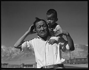 Manzanar Relocation Center, Manzanar, California. Grandfather and grandson of Japanese ancestry at . . . - NARA - 537992