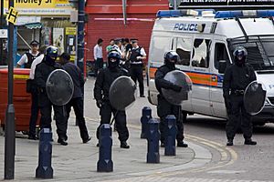 Police with riot shields in Lewisham, 2011