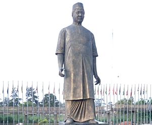 Standing with the late Dr Alex Ekwuemes Statue (cropped)