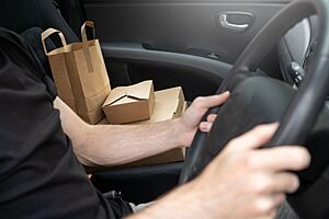 Food delivery driver in car