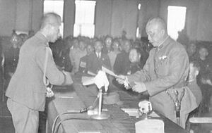 General Chen Yi of China accepts the surrender of Andō Rikichi, the Japanese Governor-General of