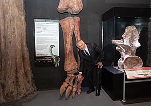 Marc R. Stanley with Patagotitan bones
