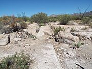 Superior-Pinal City-Wagon Wheel Tracks in stone-1897