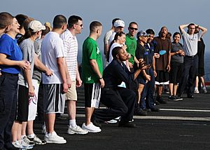US Navy 080822-N-9898L-928 ailors aboard the aircraft carrier USS Abraham Lincoln (CVN 72) enjoy a water balloon toss game on the flight deck during a steel beach picnic