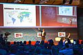 2014-03-14 CeBIT Global Conferences, Jimmy Wales, Founder Wikipedia, (26) On stage showing the world for Wikipedia Zero (500 millions), while Brent Goff is still listening