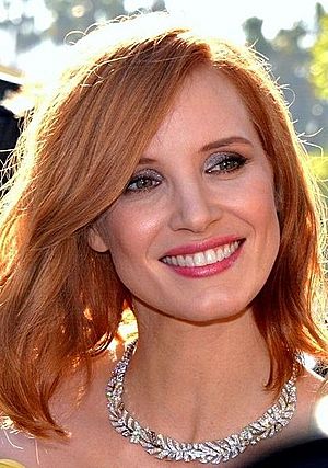 Chastain smiling at the camera