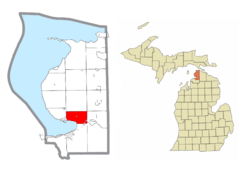 Location within Emmet County (red) and an administered portion of the Conway community (pink)