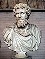 Bust of Septimius Severus (reign 193–211 CE). White, fine-grained marble, modern restorations (nose, parts of the beard, draped bust)