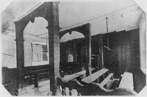 "View of classroom at Eton College, England, showing plainess of the furniture and names carved thereon by the... - NARA - 298013