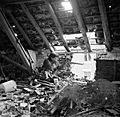 A sniper from "C" Company, 5th Battalion, The Black Watch, 51st (Highland) Division, in position in the loft space of a ruined building in Gennep, Holland, 14 February 1945. B14628