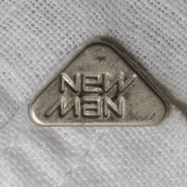 Ambigram New Man logo metal button on a shirt animated gif