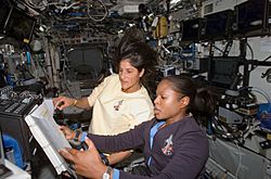 Astronauts Joan Higginbotham (STS-116) and Sunita Williams (Expedition 14) on the International Space Station
