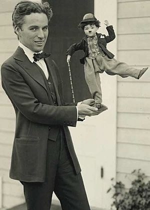 Charlie Chaplin with doll