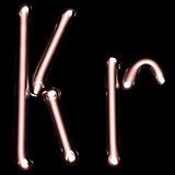 Illuminated white gas discharge tubes shaped as letters K and r