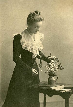 Margaret Sybella Brown with flowers and books.jpg